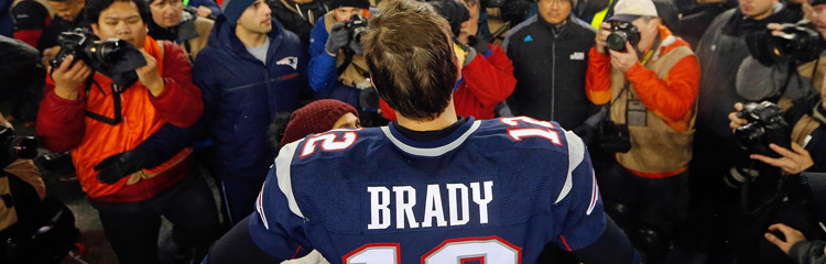 Tom Brady is approached by the press after a win